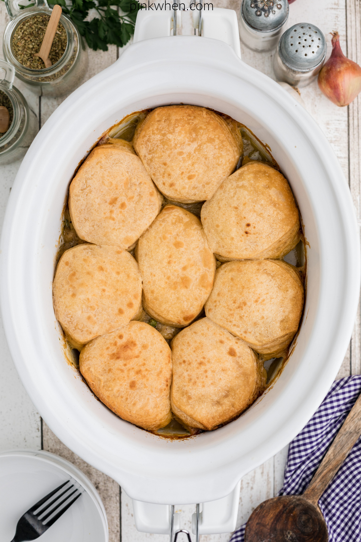 Slow cooker chicken pot pie with biscuits on top.