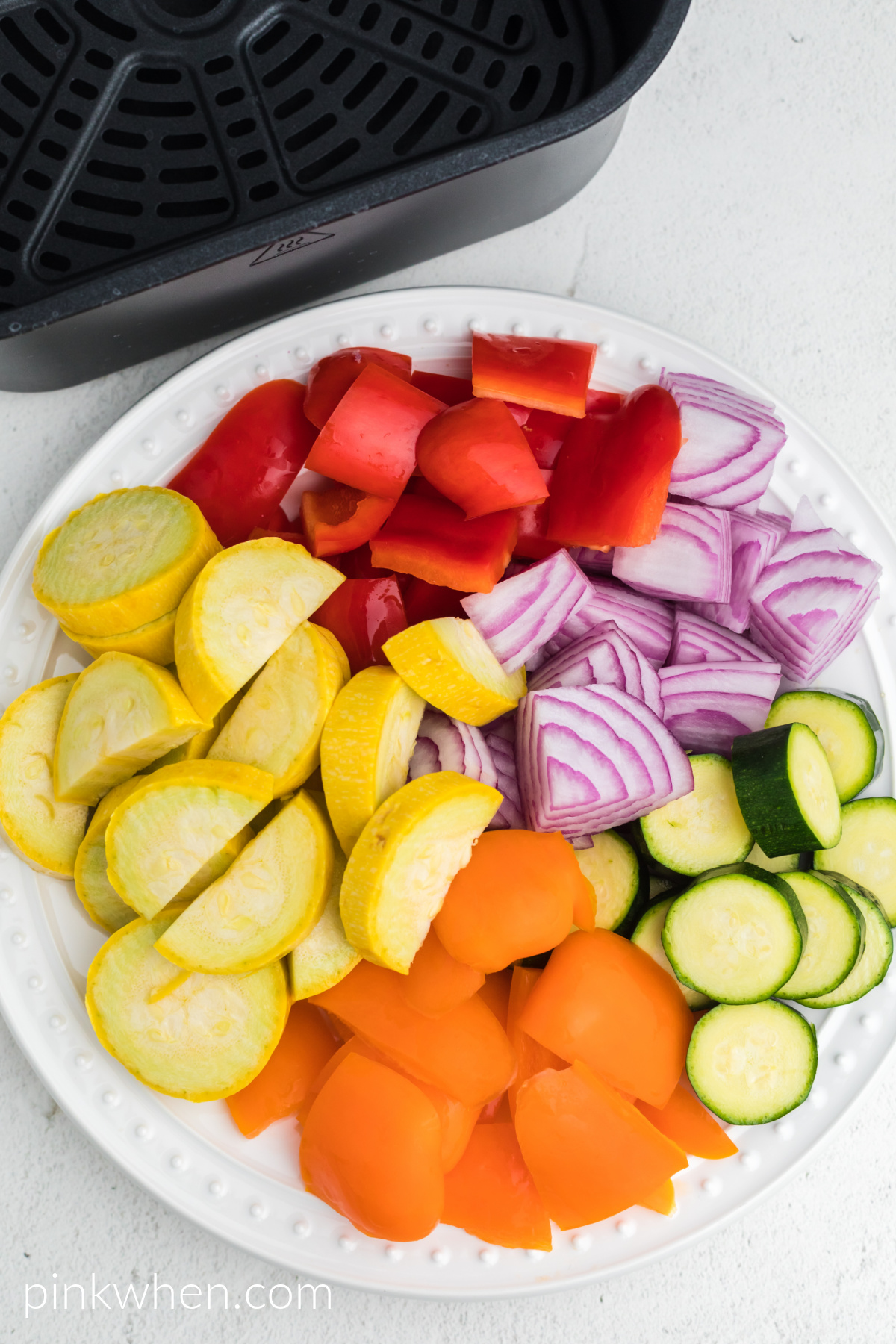 Vegetables sliced and on a plate.