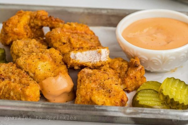 Air fryer nuggets on a sheet pan.