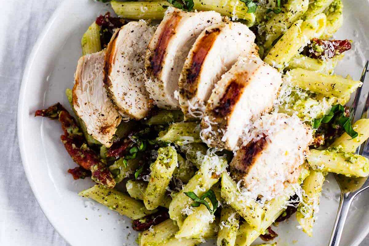 Pasta with pesto, chicken and sun dried tomatoes.