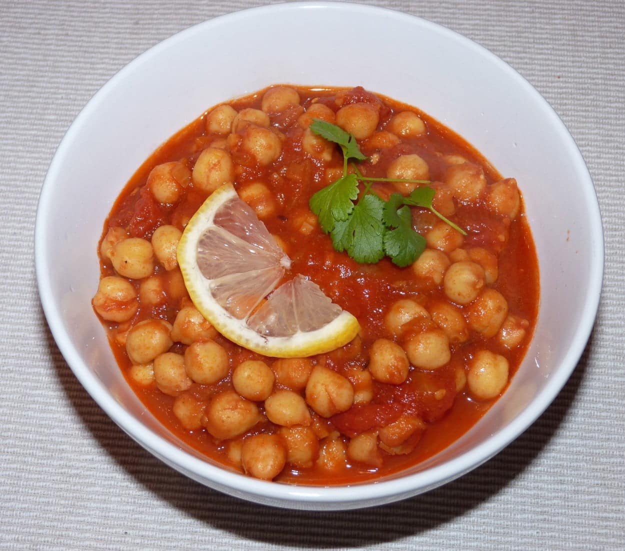 India’s Chana Masala chickpea curry in a white bowl.
