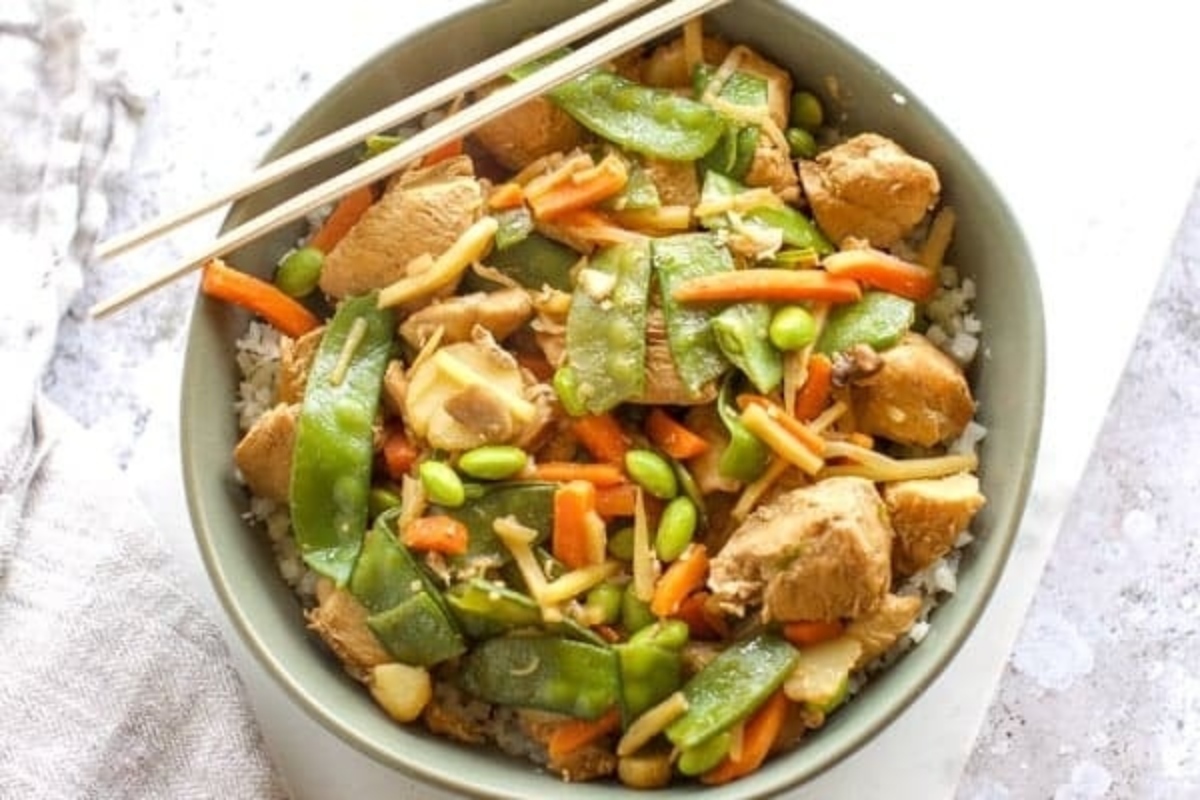 Stir fry with snap peas, carrots and tender chunks or chicken over cauliflower rice.