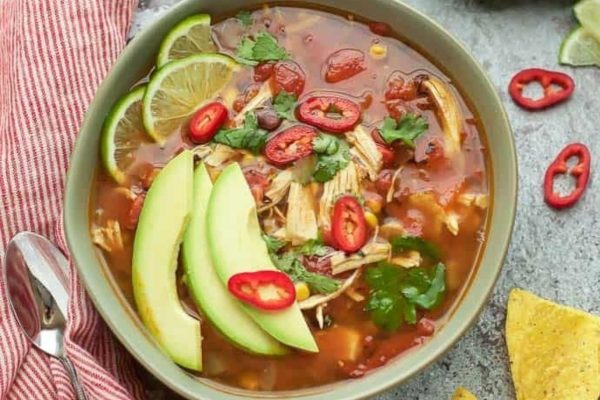 Instant Pot Chicken Tortilla Soup served with avocado slices in a bowl. 