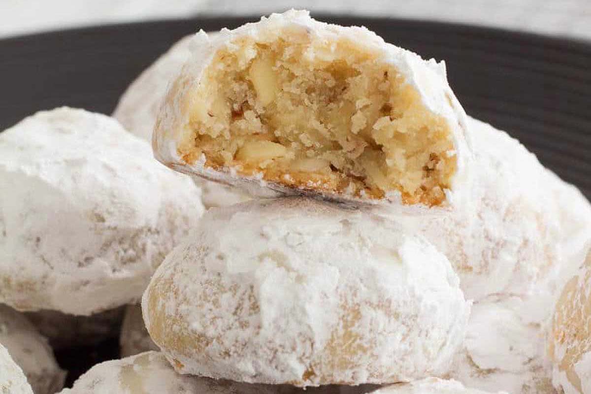 Powdered sugar covered Italian wedding cookies.