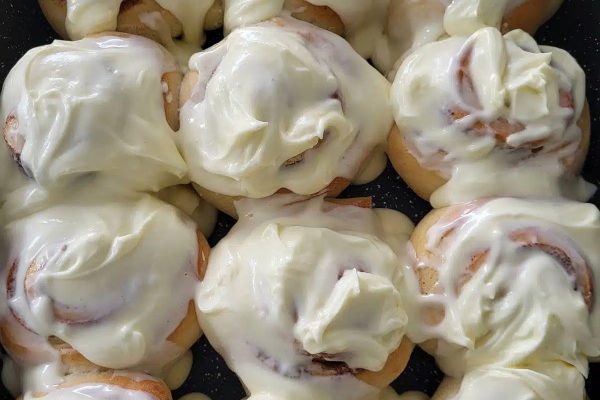 Maple Pecan Cinnamon Rolls with creamy frosting.