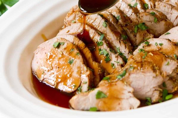 Oven Roasted Pork Tenderloin drizzled with balsamic glaze.