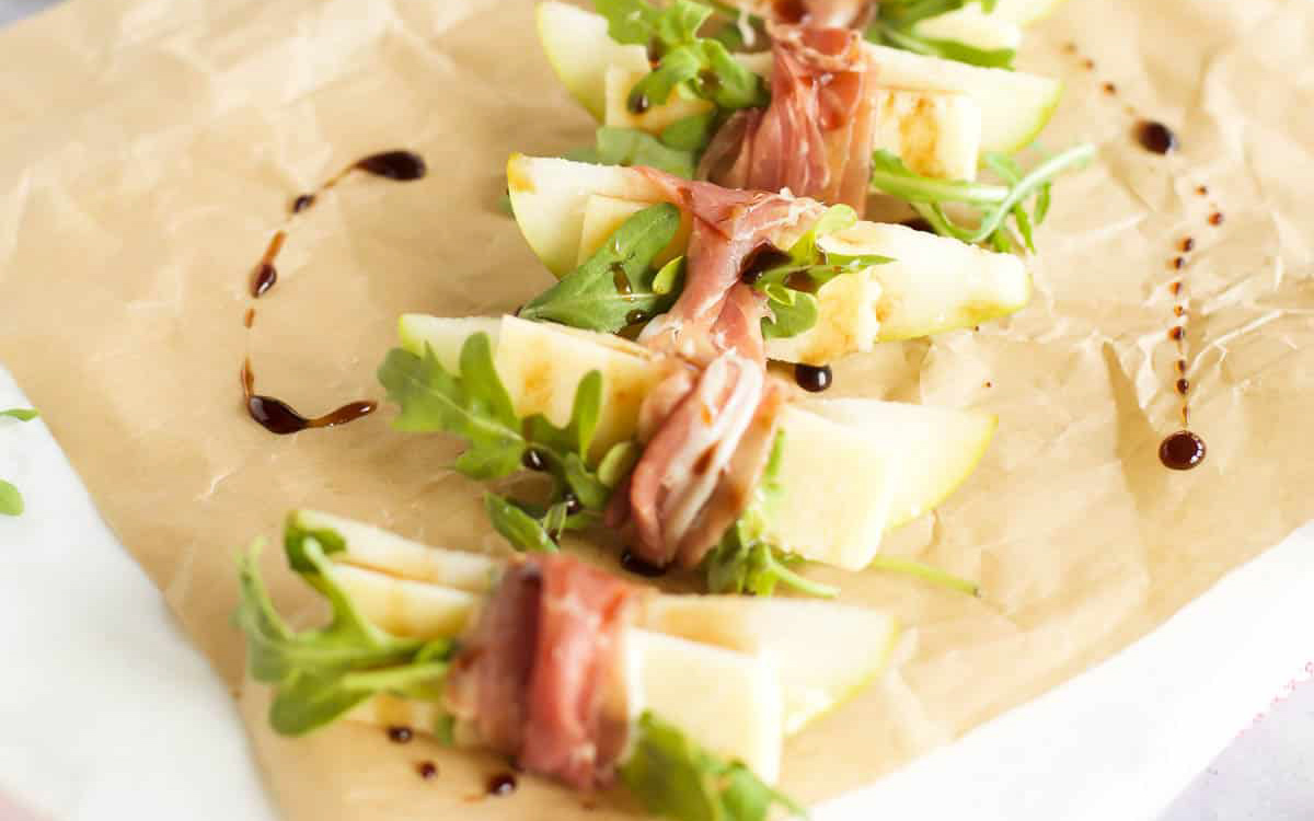Pears with prosciutto wrapping.