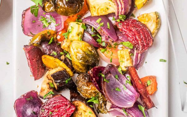 Roasted vegetables mixed together on a plate.