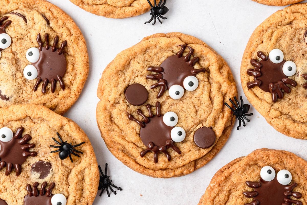 Cookies with spider chocolate on top with eyes.