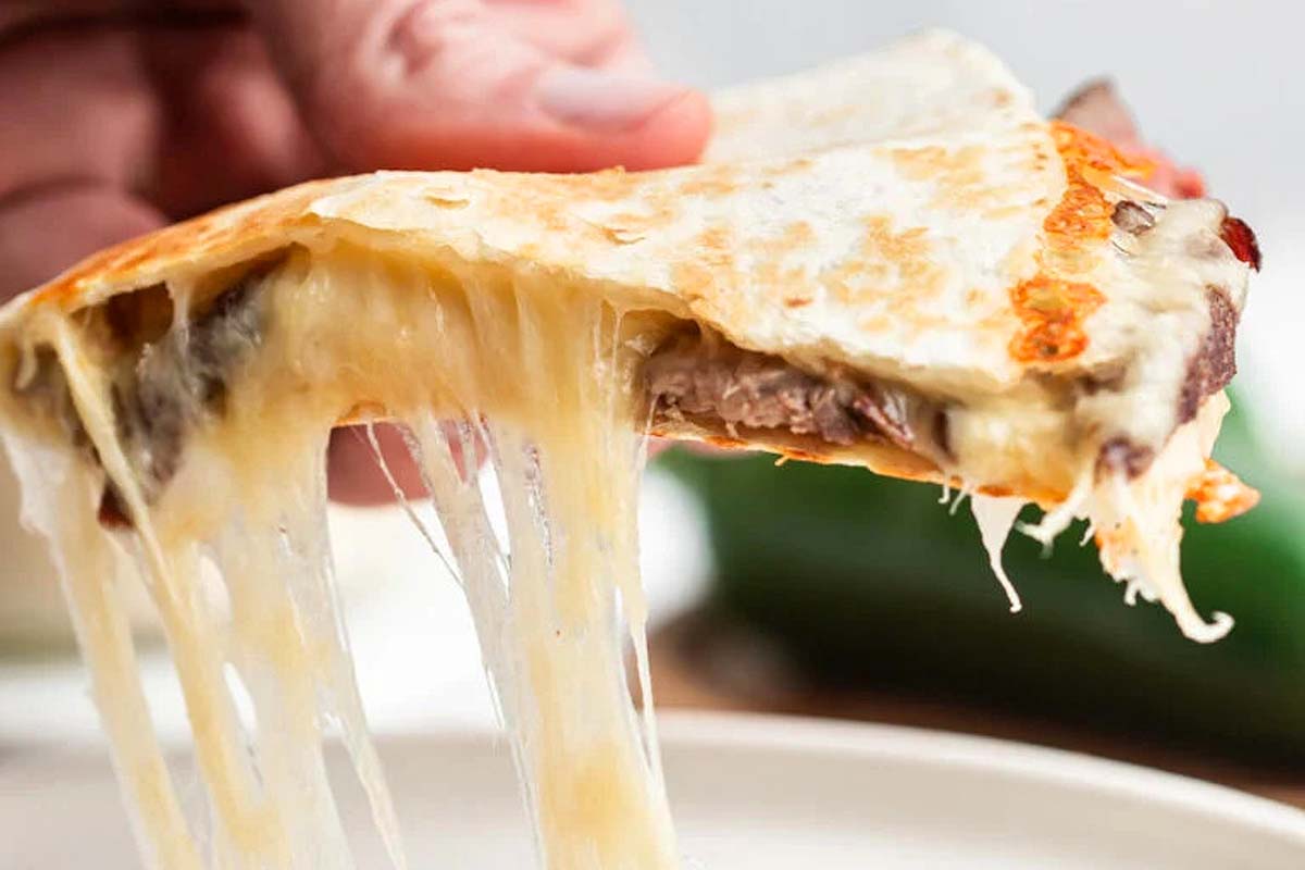 A quesadilla made with steak and cheese.