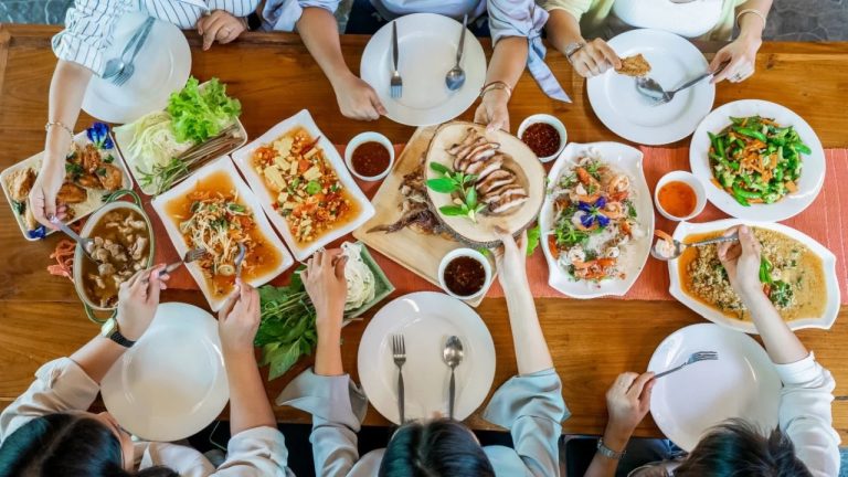 Topview of Thai local food arranged on wood table.