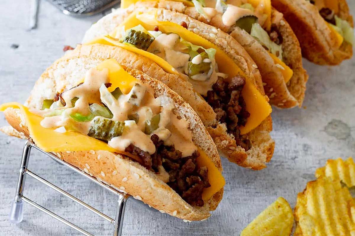 A stack of tacos on a rack.