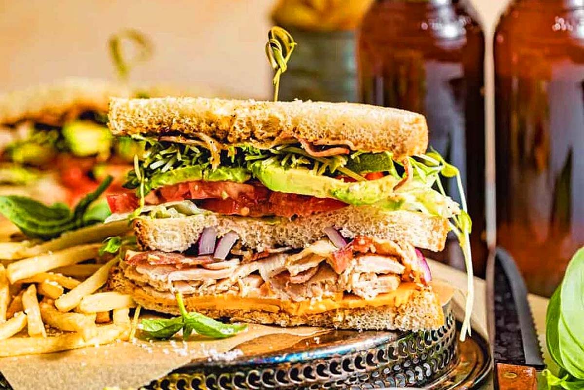 A club sandwich cut in half and stacked.