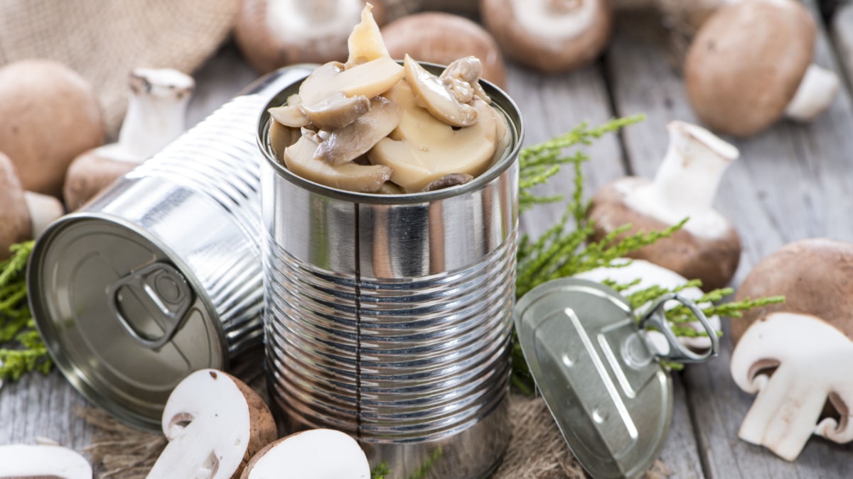 Canned Mushrooms on a table.