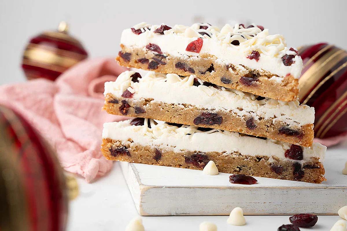 A stack of homemade cranberry bliss bar.s