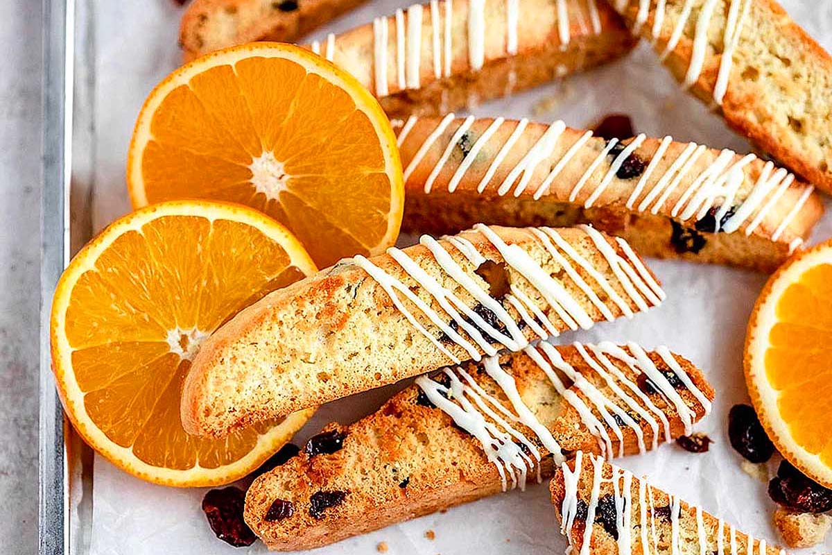 Cranberry orange biscotti drizzled with icing.