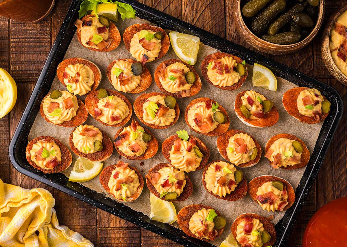 Bloody Mary Deviled Eggs on a baking tray.