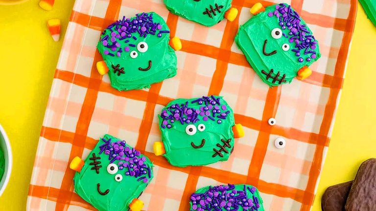 Frankenstein Halloween Cookies on a orange cookie tray.