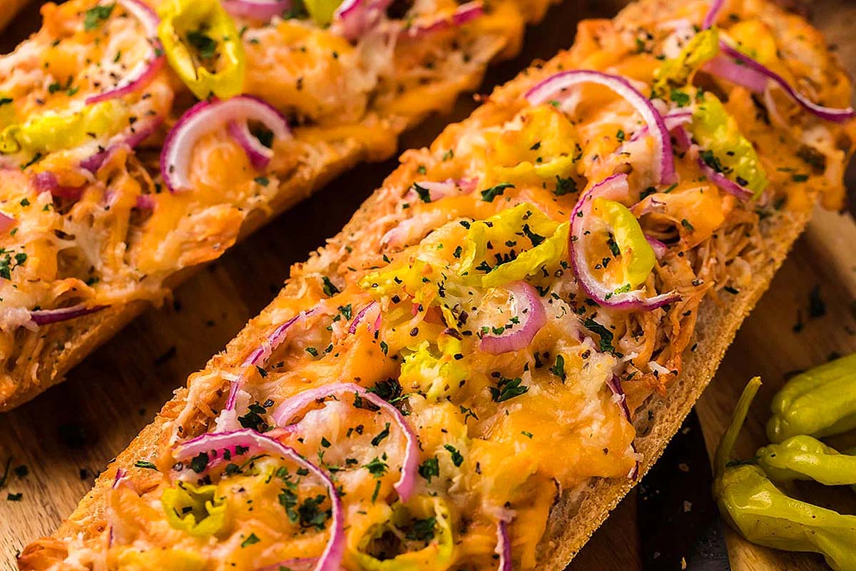 A french bread pizza with BBQ chicken.