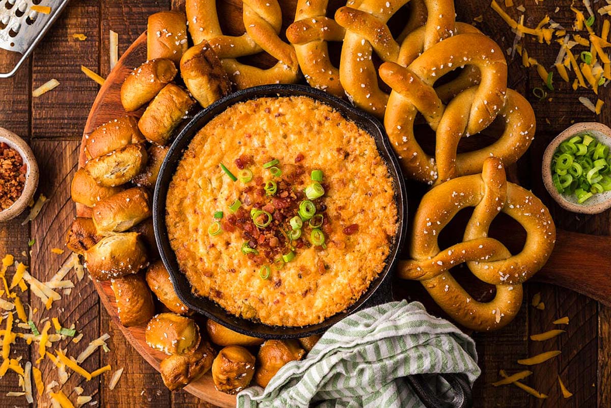 A smoked gouda dip recipes served with pretzels.