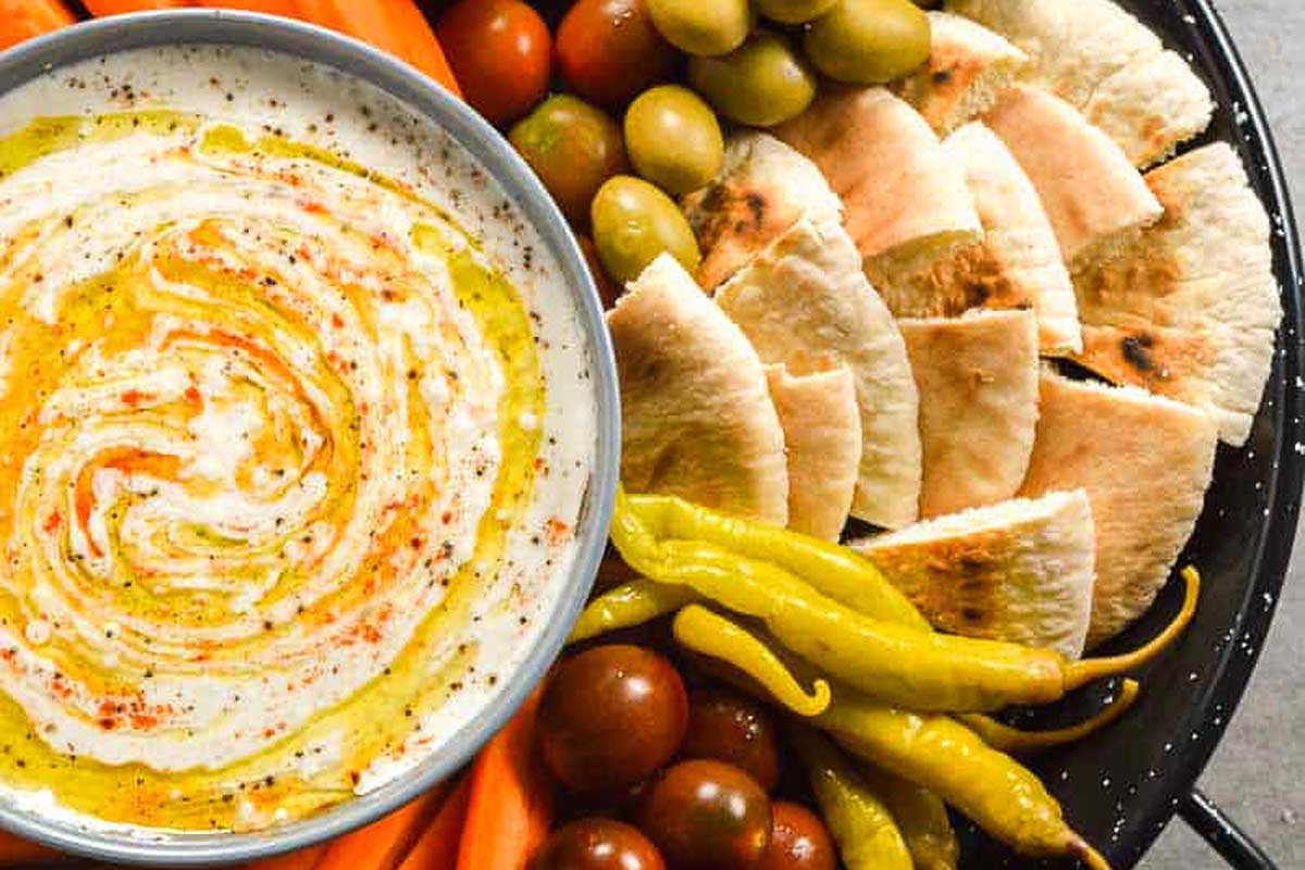 Spicy Feta Dip with pita and vegetables.