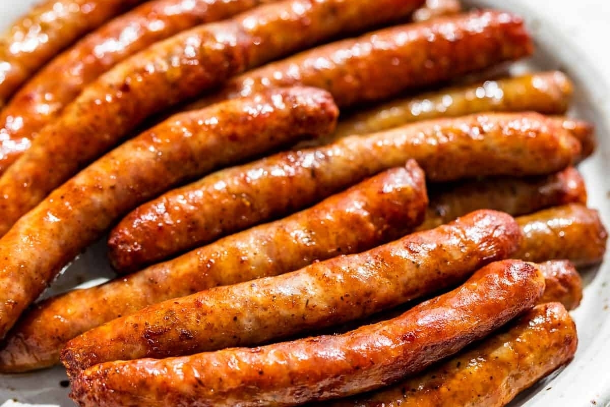 Winter recipes for sausages cooked in an air fryer, showcased on a white background.