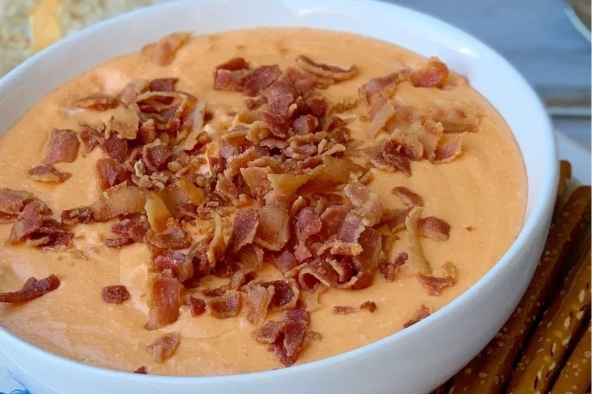 A slow cooker dip with bacon and pretzels.
