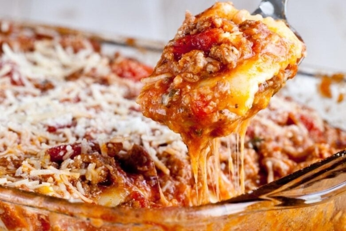 Lasagna with meat and cheese in a casserole dish.