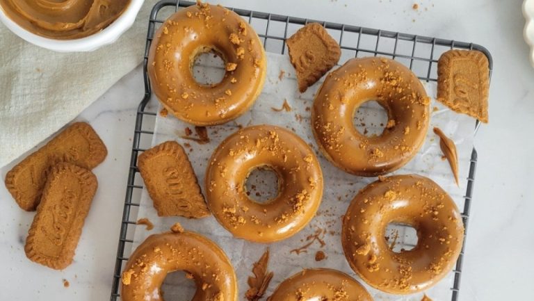Peanut butter donuts on a cooling rack.