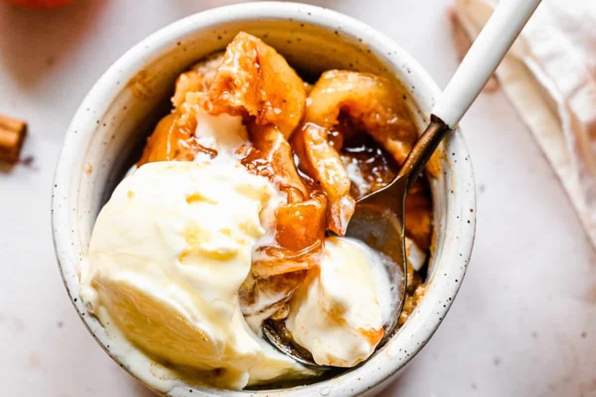 Apple cobbler with spoon on the side.