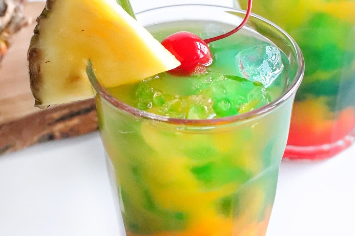 A Hawaiian-inspired drink with a cherry on top, perfect for a luau.