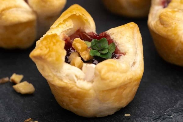 Mini cranberry tarts with cranberry filling. Perfect for holiday recipes.