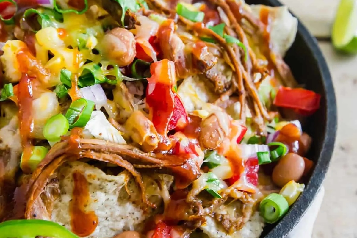 Mexican nachos in a cast iron skillet.