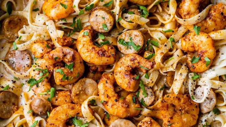 Shrimp and mushroom pasta in a skillet.