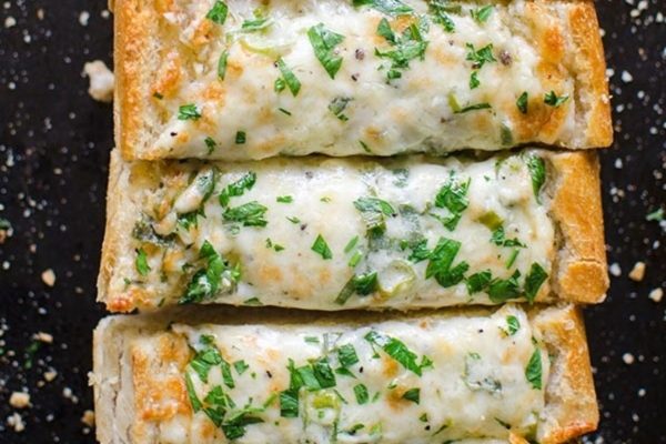 Cheesy garlic bread with parmesan cheese and parsley.