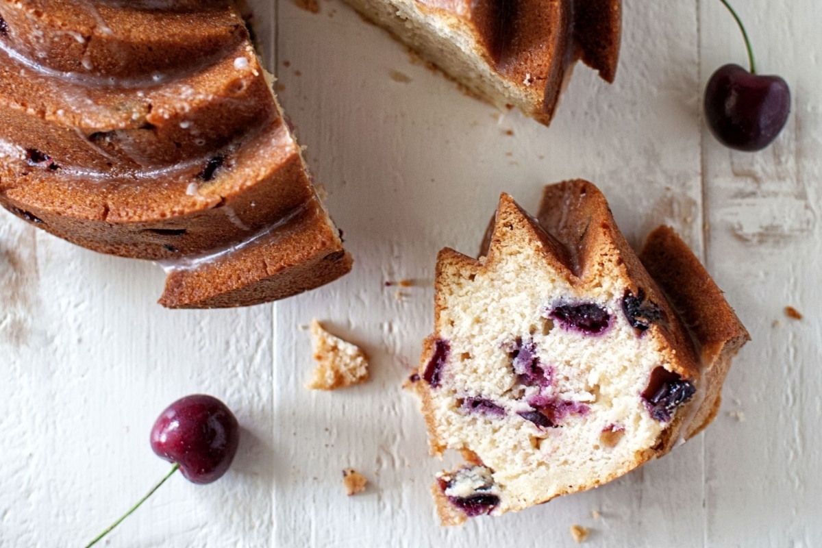 A delicious Bundt cake with cherries on top.