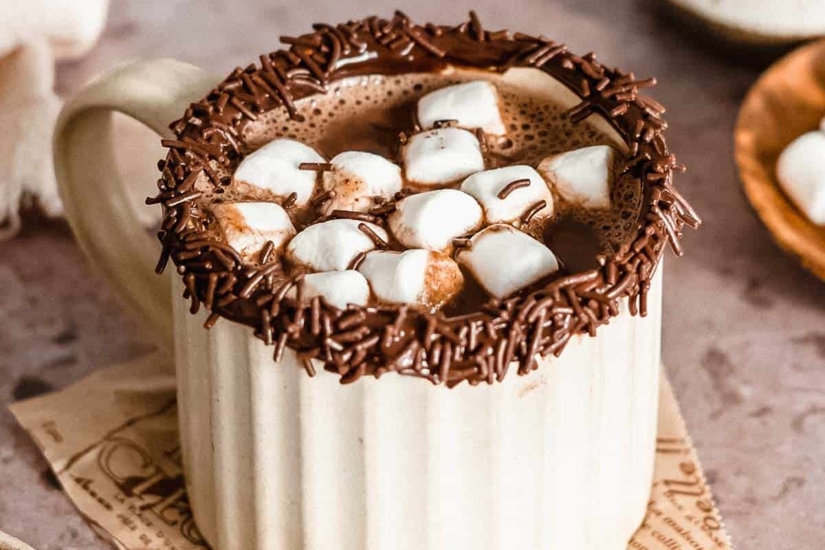 A creamy mug of hot chocolate topped with marshmallows.