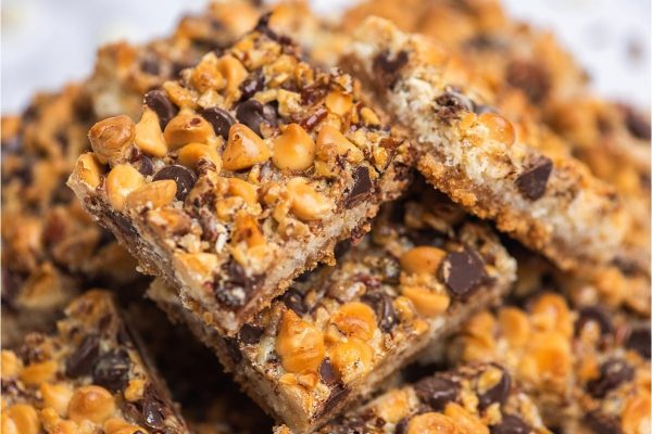 A stack of chocolate chip granola bars on a white background.