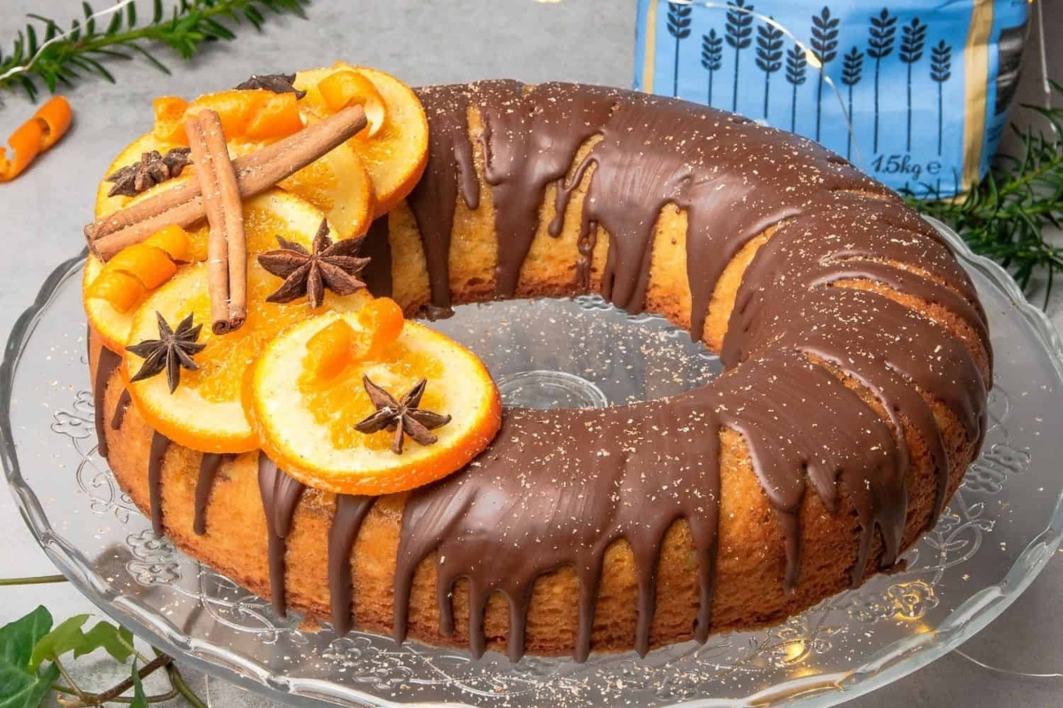 A delicious Bundt cake adorned with zesty oranges and aromatic spices.