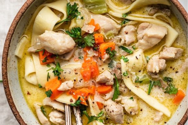 Creamy chicken noodle soup in a bowl.