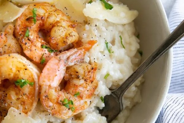 A bowl of risotto with shrimp and parmesan.