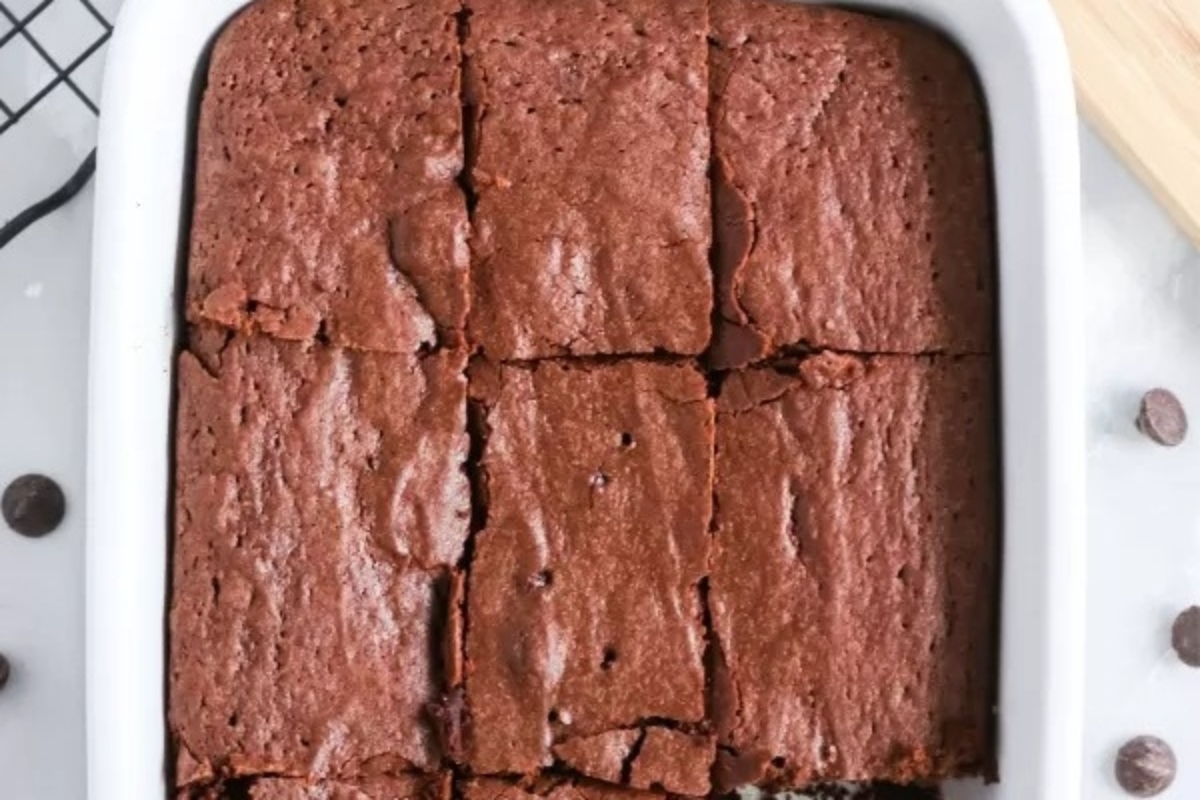 28 Brownie Recipes Chocolate Lovers Will Crave 13 Brownies in a white baking dish with chocolate chips, perfect for indulging in delicious homemade brownies.