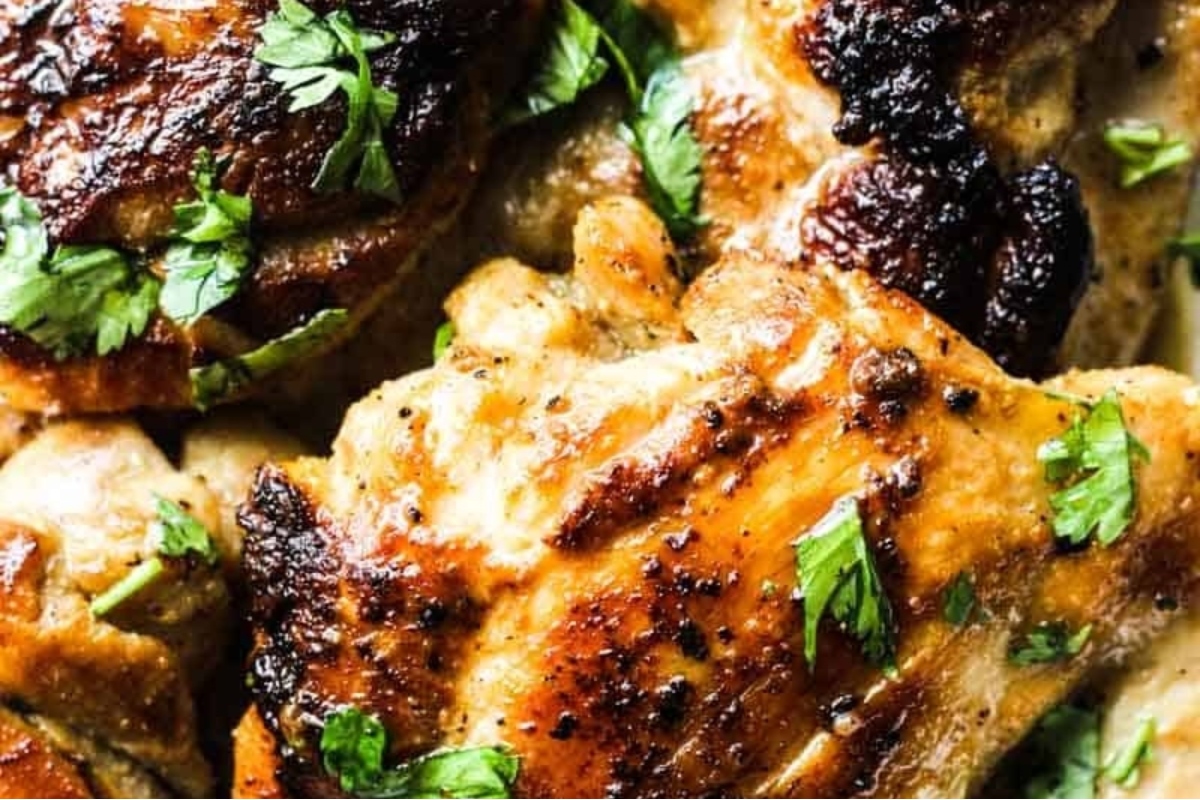 A close up of Hawaiian-inspired chicken breasts with herbs.