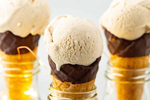 Traditional ice cream cones filled with chocolate ice cream.