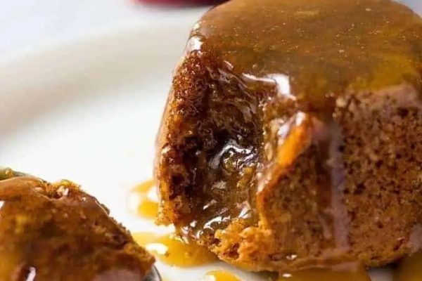 A festive plate with a delightful piece of caramel pudding, perfect for Christmas desserts.
