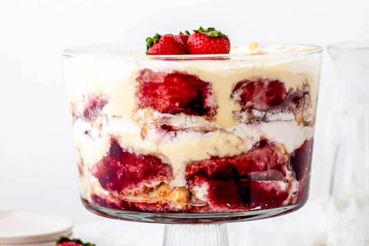 Trifles made with fresh strawberries served in a glass bowl.