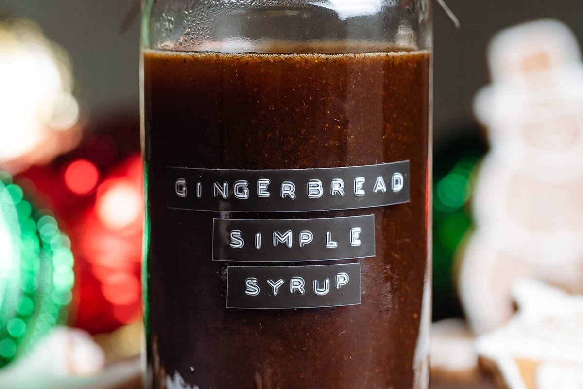 Gingerbread simple syrup in a jar. Perfect for adding festive flavors to your favorite recipes.