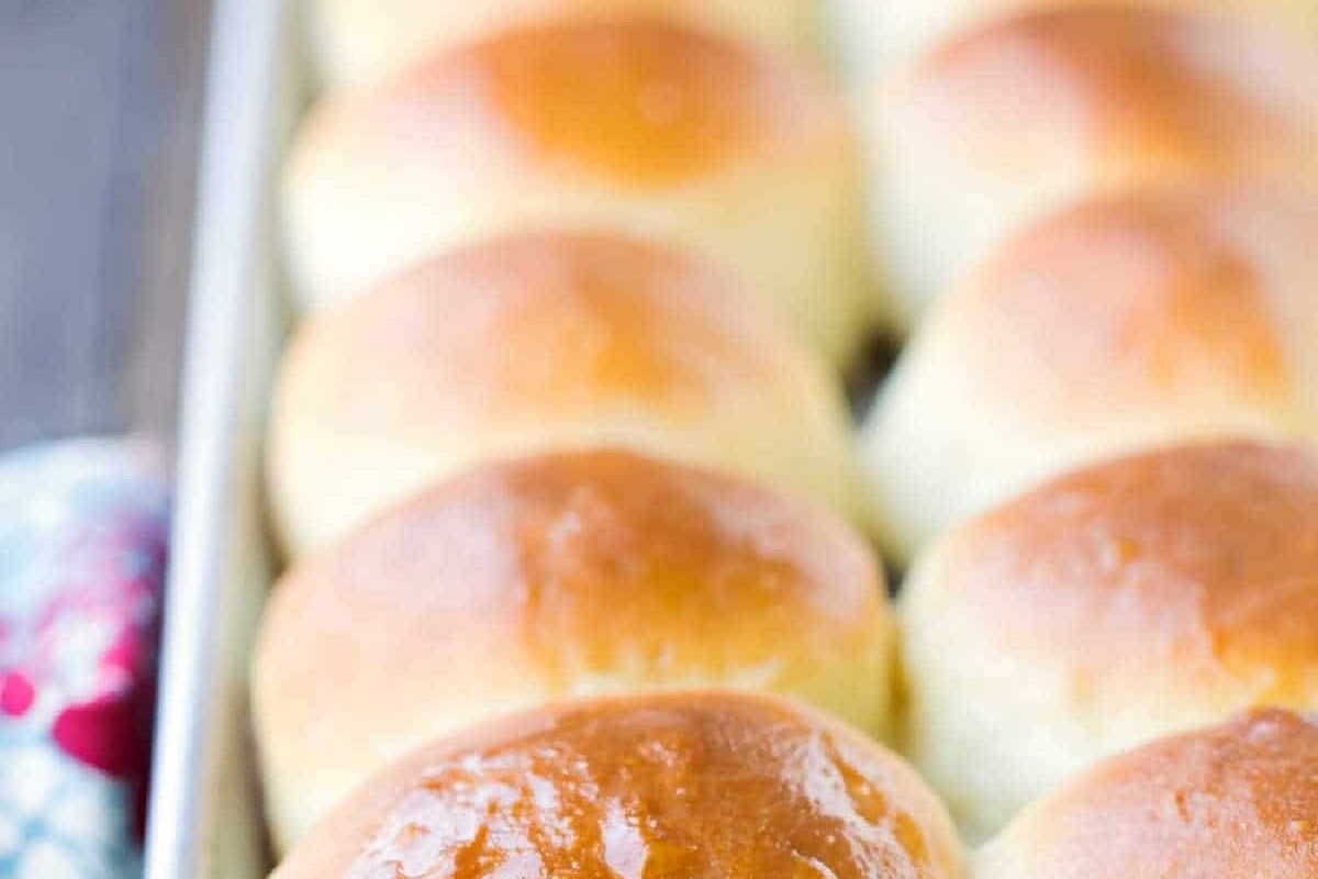 Delicious bread rolls arranged in a baking pan for your next homemade recipes.