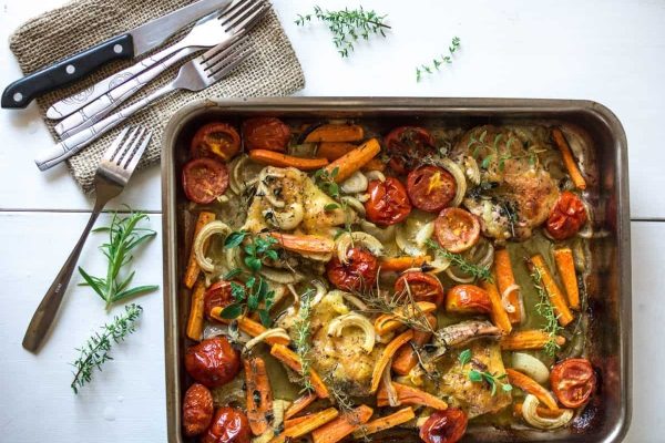 Sheet Pan Recipes: Chicken and vegetables in a baking dish.
