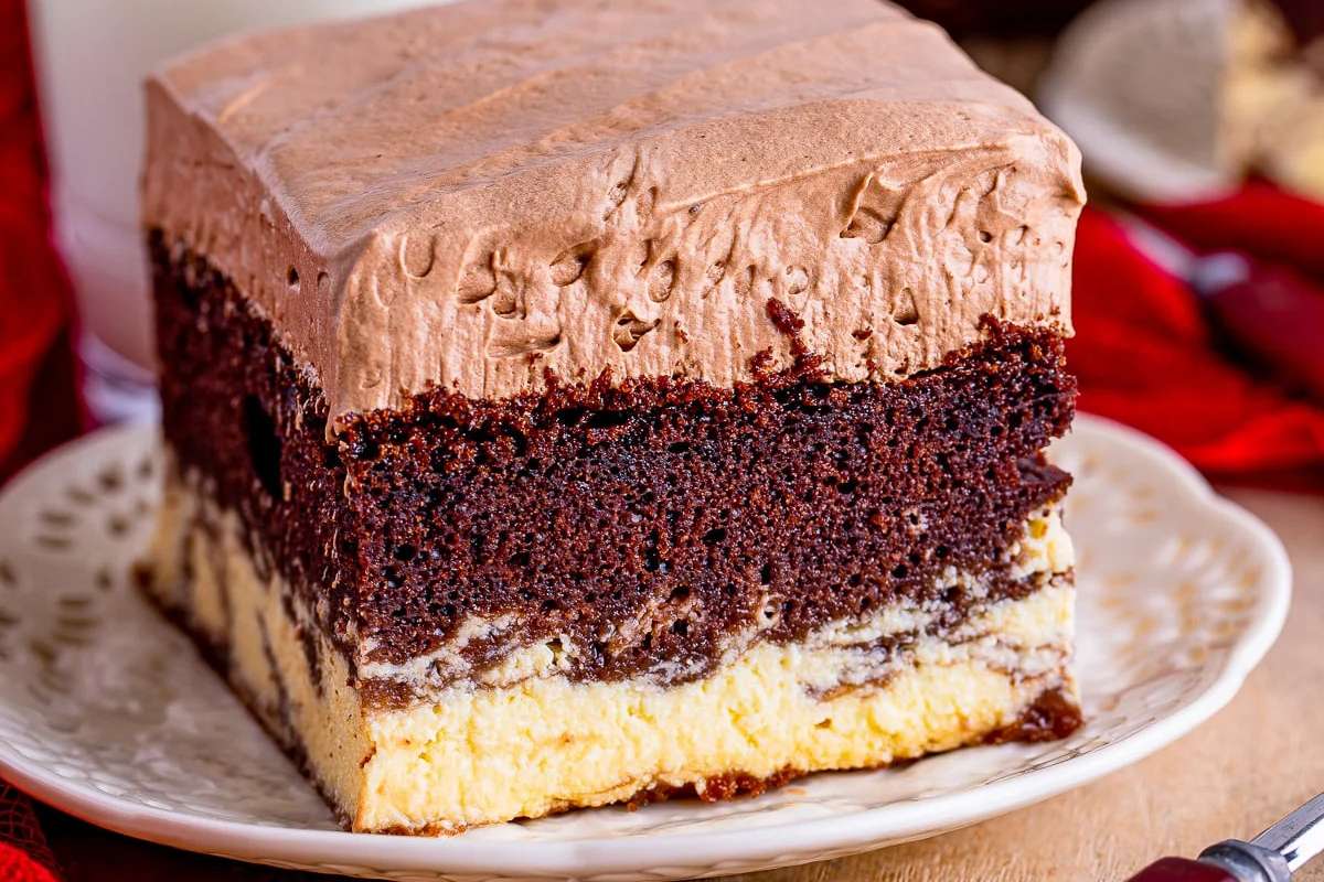 A slice of Italian chocolate cake on a plate with a fork.